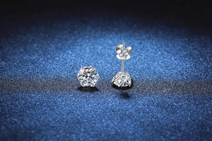 Macro detail of S925 sterling silver stud earrings with six-prong moissanite setting
