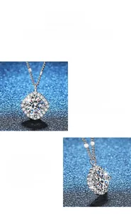 Detail view of round cut moissanite pendant with halo setting and polished silver finish