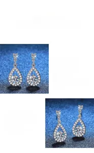 Macro detail of teardrop Moissanite earrings with polished S925 sterling silver settings