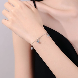 Elegant S925 silver chain bracelet featuring three blue moissanite square pendants for women
