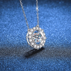 Dancing S925 sterling silver necklace with a 1ct moissanite halo pendant on blue background