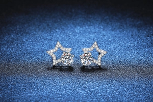 Detail of S925 silver star earrings featuring 1 carat moissanite with micro-pave setting
