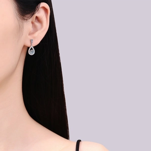 Elegant S925 sterling silver teardrop earrings with a central moissanite stone