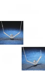 Detail of V-shaped S925 silver pendant with round brilliant cut moissanite in prong setting