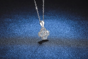 Detailed shot of s925 silver four-leaf clover pendant with sparkling moissanite stones