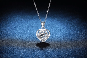 Macro detail of S925 sterling silver heart necklace with sparkling round moissanite stone
