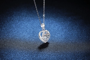 Close-up of heart-shaped S925 silver necklace with 1 carat moissanite and side stones