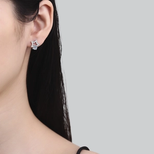 S925 sterling silver star stud earrings featuring D color 1ct moissanite on model