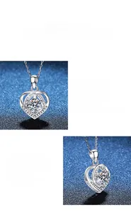Macro detail of heart moissanite pendant featuring prong setting and polished silver finish