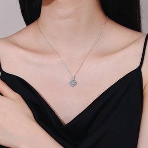 S925 sterling silver four-leaf clover necklace with light blue moissanite on model
