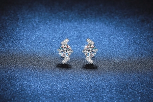 Macro view of S925 silver stud earrings featuring 2 carat round cut Moissanite stones