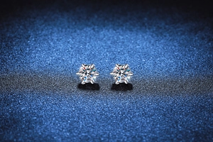 Macro shot of six-prong moissanite stud earrings in S925 sterling silver with brilliant cut
