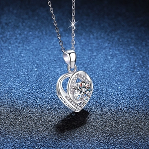 S925 Sterling Silver heart necklace with 1ct Moissanite pendant on a dark blue background