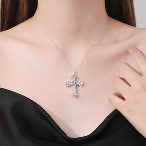 Elegant S925 sterling silver cross necklace with a large moissanite center stone on model