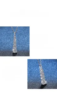 Detailed view of multiple round cut Moissanite stones on a polished silver necklace