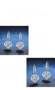 Detailed macro view of S925 silver heart earrings featuring sparkling moissanite stones