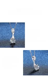 Macro view of polished S925 sterling silver bow pendant featuring a 1-carat moissanite stone