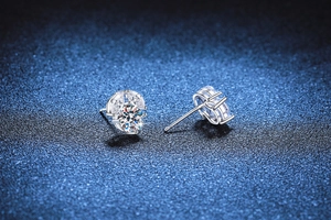Detail of S925 sterling silver flower earrings with D color round moissanite in prong setting