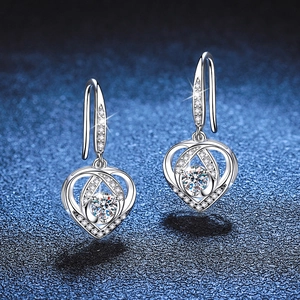 S925 sterling silver heart-shaped drop earrings with moissanite stones on dark background