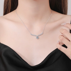 Elegant S925 sterling silver V-shaped necklace with moissanite pendant on a model neck