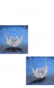 Detail of heart-shaped swan pendant with a 1-carat moissanite and pink stones