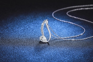 Macro shot of S925 silver pear-shaped moissanite pendant with sparkling brilliance
