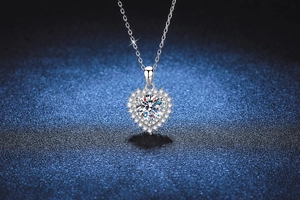 Macro detail of a 2-carat heart-shaped moissanite halo pendant on a S925 silver chain