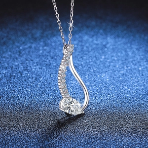 S925 sterling silver necklace with teardrop moissanite pendant on navy starry background