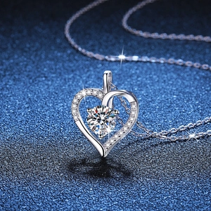 S925 sterling silver heart necklace with 1ct moissanite pendant on blue glitter background