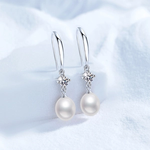Elegant 925 sterling silver hook earrings featuring white freshwater pearls and moissanite stones