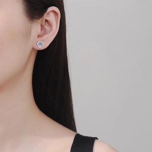 S925 sterling silver camellia stud earrings with 1ct moissanite stones on model
