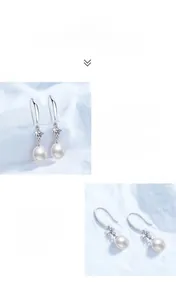 Detail of S925 silver earrings with natural freshwater pearls and moissanite stones