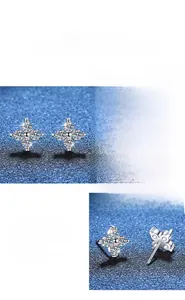 Detail of S925 sterling silver cross earrings with high-grade moissanite stones and polished finish
