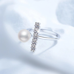 Adjustable S925 sterling silver ring featuring a round white pearl and sparkling moissanite stones