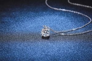 Macro shot of 1 carat moissanite pendant with four-prong setting and S925 silver chain
