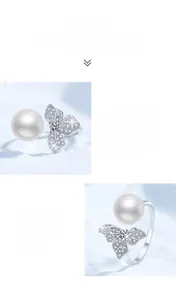 Close-up of S925 silver ring featuring clover butterfly moissanite and freshwater pearl