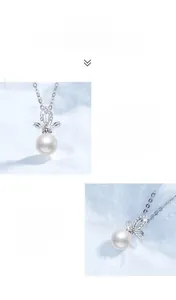 Close-up of elegant S925 silver necklace with white freshwater pearl and moissanite pendant
