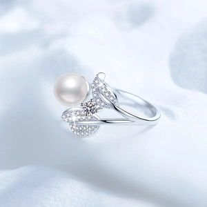 Macro shot of S925 silver ring featuring a round pearl and micro-paved diamond petals