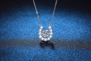 Detailed view of U-shaped S925 silver pendant with floating Moissanite stone