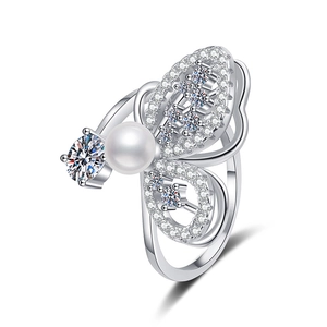 Adjustable S925 silver butterfly ring featuring a brilliant moissanite and white pearl