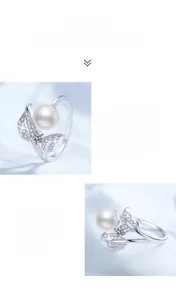 Macro shot of S925 silver ring featuring fresh water pearl and moissanite leaf detail