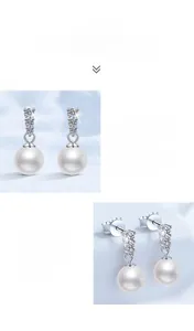Detail of S925 silver earrings with natural freshwater pearls and moissanite stones