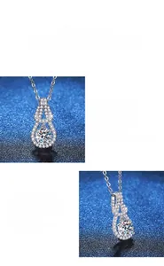 Detailed close-up of double-layered teardrop moissanite pendant in S925 sterling silver