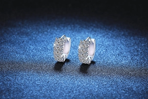 Close-up of S925 sterling silver hoop earrings with shimmering moissanite stones