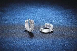 Macro shot of S925 sterling silver hoop earrings with dazzling pavé set moissanite stones