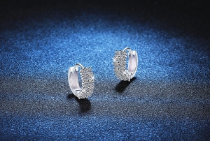 Detailed close-up of S925 sterling silver hoop earrings with shimmering double-row pavé moissanite