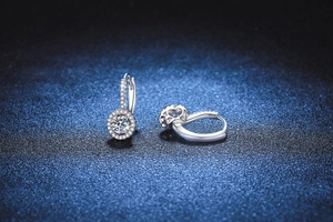 Detailed macro view of S925 sterling silver halo stud earrings with round moissanite