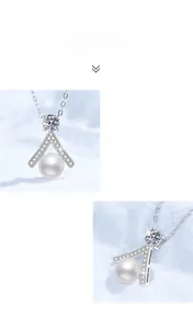 Macro detail of V-shaped S925 silver pendant with moissanite and round freshwater pearl