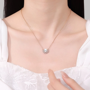 Elegant s925 silver necklace with white pearl pendant and moon-shaped zircons on model