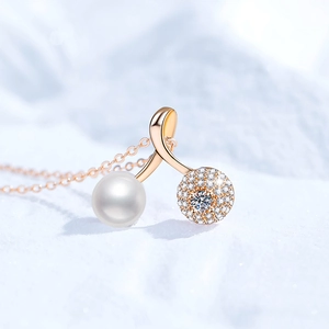 Elegant rose gold music note necklace with a white pearl and shimmering pavé diamonds